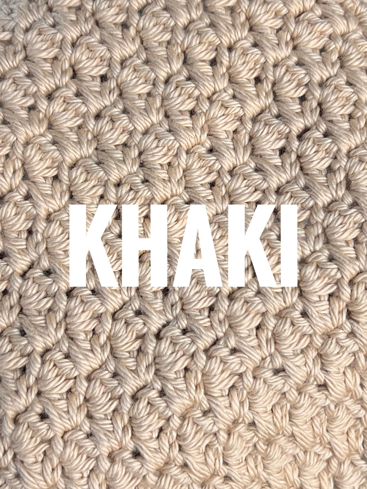 A close-up of a chunky crochet washcloth swatch in a warm khaki beige color, with the word 'KHAKI' overlaid in large white letters across the center.