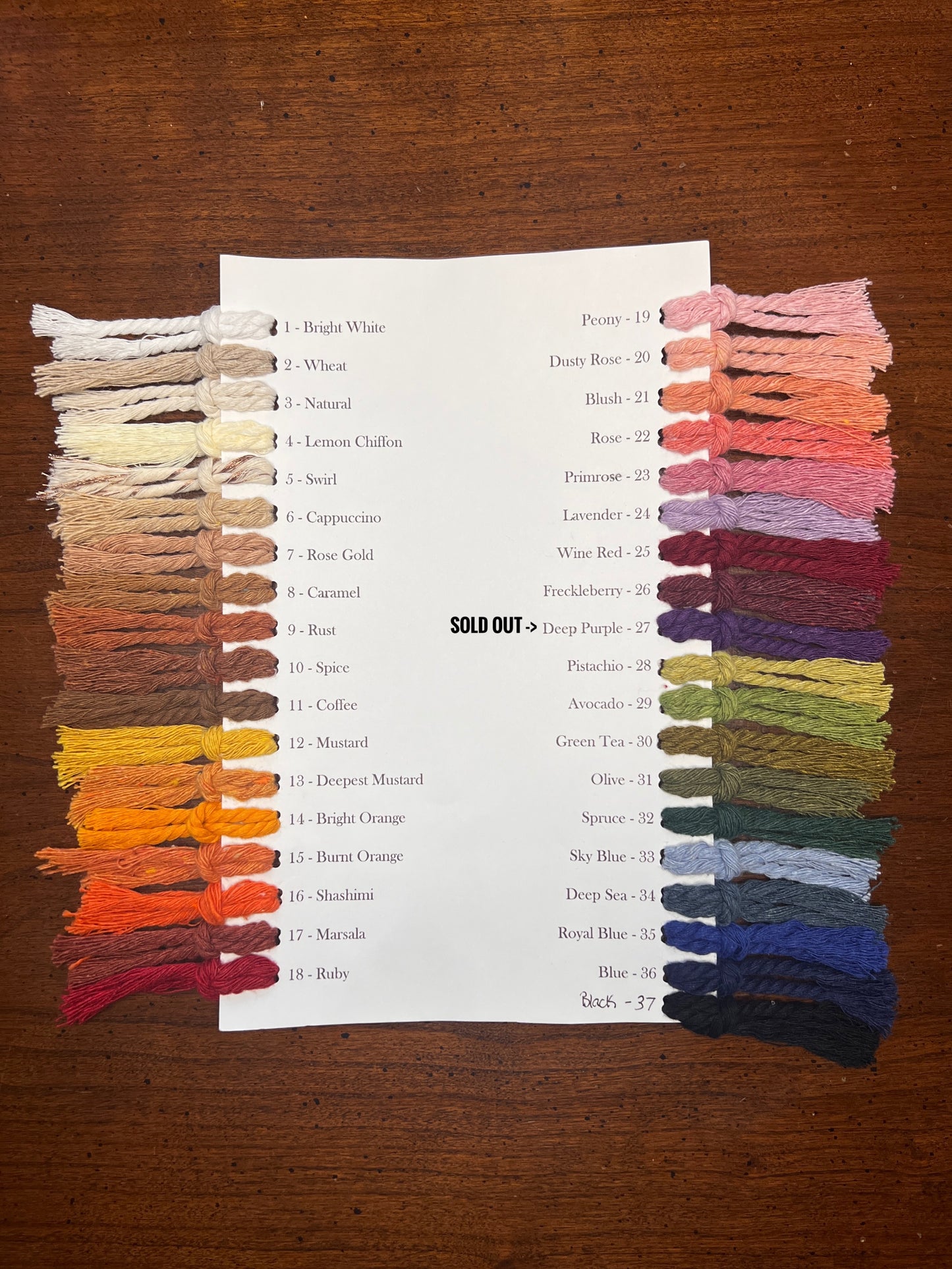 Color swatches with macrame cord on a wooden surface